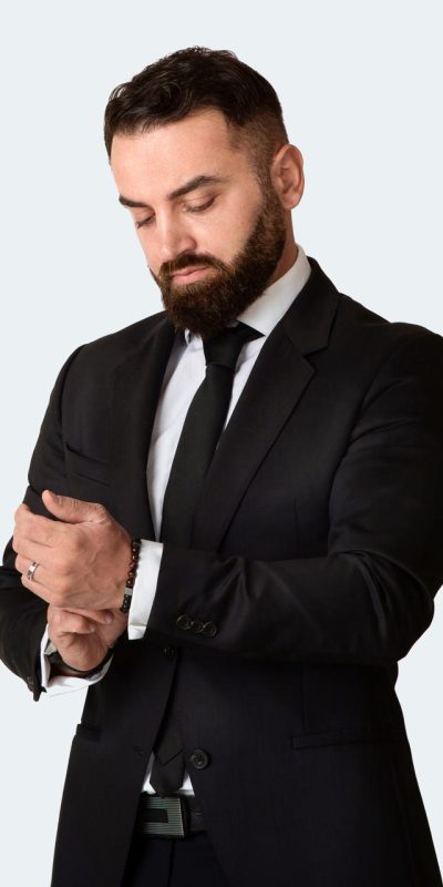 serious-entrepreneur-wearing-business-suit-on-grey-2025-03-18-15-39-48-utc.jpg